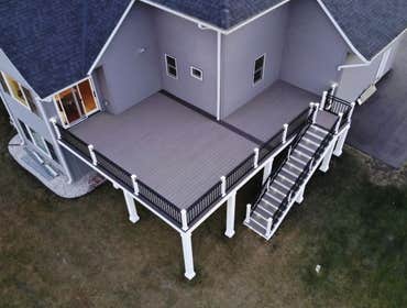 Photos by Define Decks LLC #1 This deck has it all. Helical pile footings, Azek decking, Westbury Riviera railing, Miratec trim and post wraps, and lig