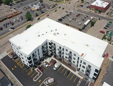 Photos by Nasi Roofing LLC #9 This new construction project, Banter Apartments, in Stevens Point WI used 60 mil White Duro-Tuff and received a 15 year 