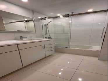 Bath Remodel - W115th St This customer had both a shower and bath, they eliminated the shower, kept the tub and created lots of storage and a double va