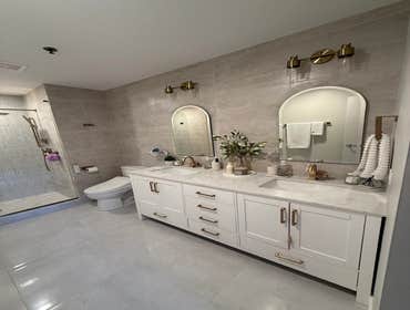 Sophisticated Bathroom Remodel Transformed the bathroom into a stunning, high-end space with luxurious finishes and sleek, modern design.