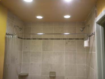 Bathroom remodel Complete tear down and build up of a bathroom including installation of a custom 7 foot shower stall with double shower heads