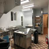 Commercial Kitchen Custom tile installation, Install FRP on walls. Stainless steel shelves.