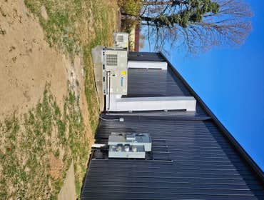 Photos by Kmi HVAC Mechanical INC #1 Commercial building remodel. Three Daikin package units and new round pipe duct work.
