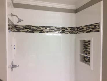Photos by North Alabama Remodeling Co. LLC #2 Cultured marble showers with tile feature inlays in custom designed bathroom remodels