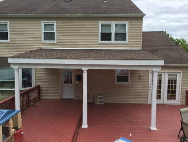 Porch Roof Project Installed footers, columns, frame roof, install lighting and fans, install siding.