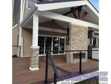 Photos by Farside Construction LLC #1 Newly constructed covered deck with standing seam cathedral style gable roof. Excavated and built a walk out egre