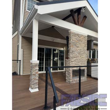 Photos by Farside Construction LLC #1 Newly constructed covered deck with standing seam cathedral style gable roof. Excavated and built a walk out egre