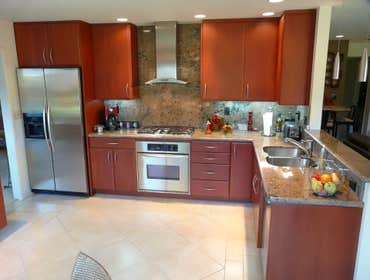2003: Sleek Modern Red Cherry Kitchen This project started as a kitchen remodel, but with change orders grew in scope to include a new family room ente