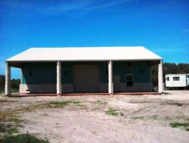 Barndominium This is a beautiful 30x60 with a 15x60 covered patio. Stained floors inside and out. Has 1 bedroom and 2 bathrooms downstairs with a kitc