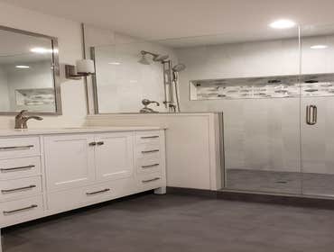 Bathroom Remodel A full rehaul of a previously tiny bathroom, where we extended it by taking a wall down, made it more spacious, functional, and up to 