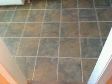 Photo(s) from Laur Moor Construction Two decks and a tiled kitchen floor