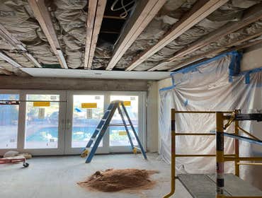 Photos by Interior Art Drywall Inc #1 Hang the walls on ceiling and walls . I just let the open on ceiling where plumbers were pending to fix the pipes