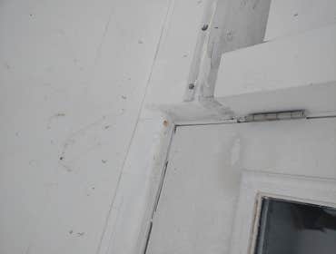DAMAGED DOOR AND FLOORING
