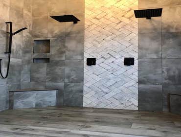 Primary Shower Removed tub and shower, created large walk-in shower with a curbless design