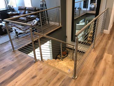 Photos by Brainz & Brawn Structures Inc #1 Stainless Steel bar handrail.. multi-tier stainless railing for interior staircase and basement access.