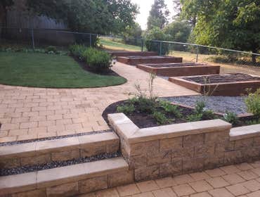 Photos by Rc Healthy Lawns #1 Full yard restoration pavers, retaining walls, vegetable gardens, flower beds, sod, shrugs ,plants and trees.