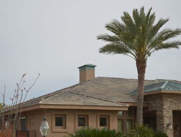 Flat concrete roof tile with copper accent