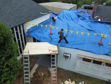 Isaac Roof Construction Commercial Roof Project Flat roof replacement with a minimum R-value of R-30 and a Class A Fire rating.