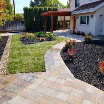 Landscaping Brand new paver patio, drought tolerant landscape with a 2 tone mulch. Customer loves their low maintenance backyard that will stay for yea
