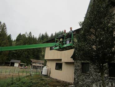 Photos by Charvet Enterprises #18 exterior on a old farm style home. this monster required a 80 ft jlg ton reach the peaks. heres a few pics of me and 