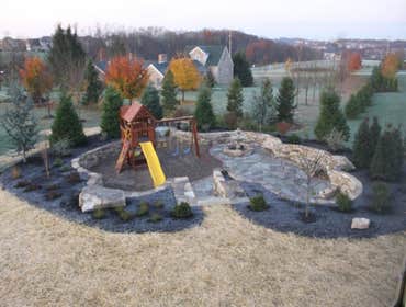 moore job this is outside stairs, seating area, sunk in play area with fire pit. intertaining area