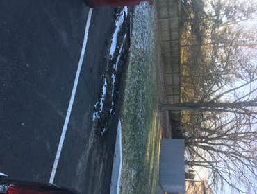 Photos by Prestige Costruction and Renovations Corp #16 Temporary fix of black top. (middle of winter garbage truck was not able to pick up dumpsters b