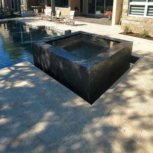 Infinity spillway raised spa