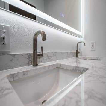 Full Bathroom Remodel Premium tiles, resilient countertops, chic vanities, sustainable fixtures, contemporary shower setups, and opulent bathtub.