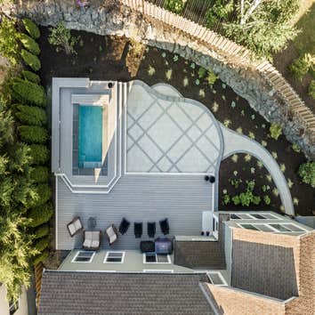 Composite deck, interlocking concrete paver, patio with pool and. Outdoor kitchen.