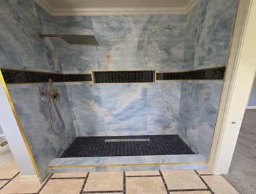 Photos by MC ALISTER TILE #1 5 showers total, was hired after another handyman did not water proof correctly, fixed all water proofing and installed 