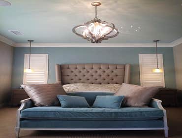 Photos by The Tradesman Electric #1 Install two custom wall sconces and add four LED can lights to the soffit area.