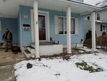Complete porch rebuild with new sidewalk and handrail Complete porch rebuild with new sidewalk and handrail.