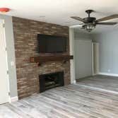 Accent Brick Wall Brick wall to enhance fireplace in Family Room