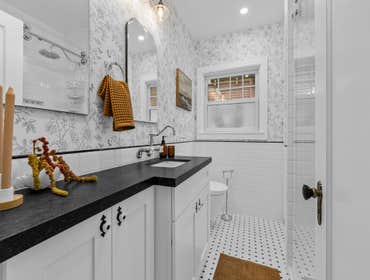 Whimsical Contrast Bath in Classic Black & White in Sacramento, CA 95818 This bathroom remodel successfully blends charm with clean, high-contrast desi