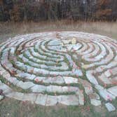Labyrinth A labyrinth is an ancient symbol that relates to wholeness. It combines the imagery of the circle and the spiral into a meandering but purpos