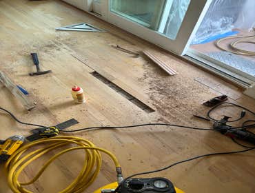 Photos by Floormasters & Design #1 Hardwood floor sanding and refinishing with some repairs.