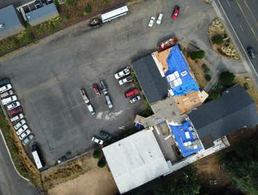Isaac Roof Construction Commercial Roof Project Flat roof replacement with a minimum R-value of R-30 and a Class A Fire rating.