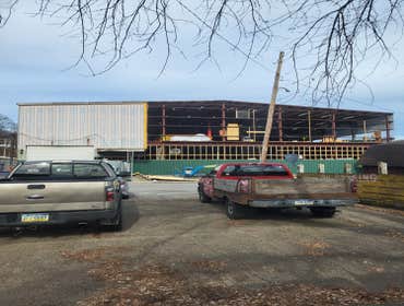 Photos by Nailed It Construction LLC #1 New metal siding on the UFP building in