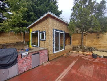 Photos by Stewart & Son Gate & Fence LLC #1 Tiny House with pergola. Small house 17' by 12' small bathroom with pocket door, and small sink with water 