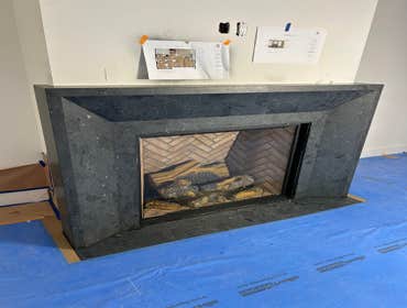 Leathered black marble fireplace surround Custom design marble slab fireplace surround