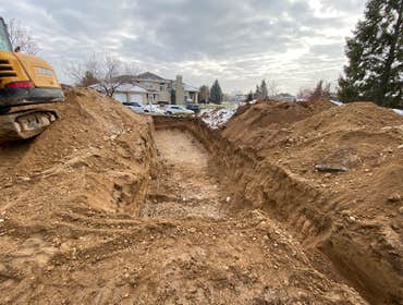 Photos by Asap Inc Replacement Septic System, Trenches being dug out.