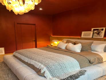 White Oak and Burgundy This primary bedroom remodel in Winter Park was part of a larger scope of work at a private Chestnut Avenue residence where four