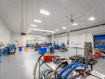 Aflex Hose Renovate portion of existing open warehouse to a pharmaceutical grade finish with floors, walls, ceilings, lights, electrical, plumbing and 