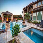 The Shapiro The cabana provides ample cooking and dining space to host gatherings for friends and family. The materials were selected to tie in as a na