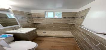 Photos by Triple A LLC #1 Complete bathroom remodel, removal of flooring and old shower and tub.