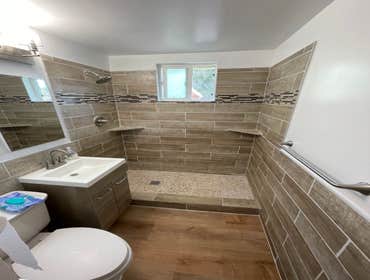 Photos by Triple A LLC #1 Complete bathroom remodel, removal of flooring and old shower and tub.