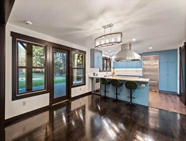 Farmhouse remodeling Project started from refreshing flooring and millwork to dark chocolate color.
Custom kitchen cabinets with beautiful blue finish