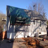 Tree Damage in Redwing Tree fell on house. New roof, kitchen, siding, windows, etc.