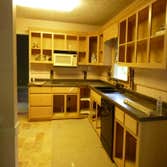 Kitchen Remodel Cabinets painted, walls with faux finish, new granite countertops, new tile travertine floors and backsplash, recessed lighting, under 