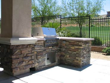 Tech-Noir Landscapes, Inc. Photos This display shows an array of fire pits, water features, and barbeques that add that special touch. Hard scape photo